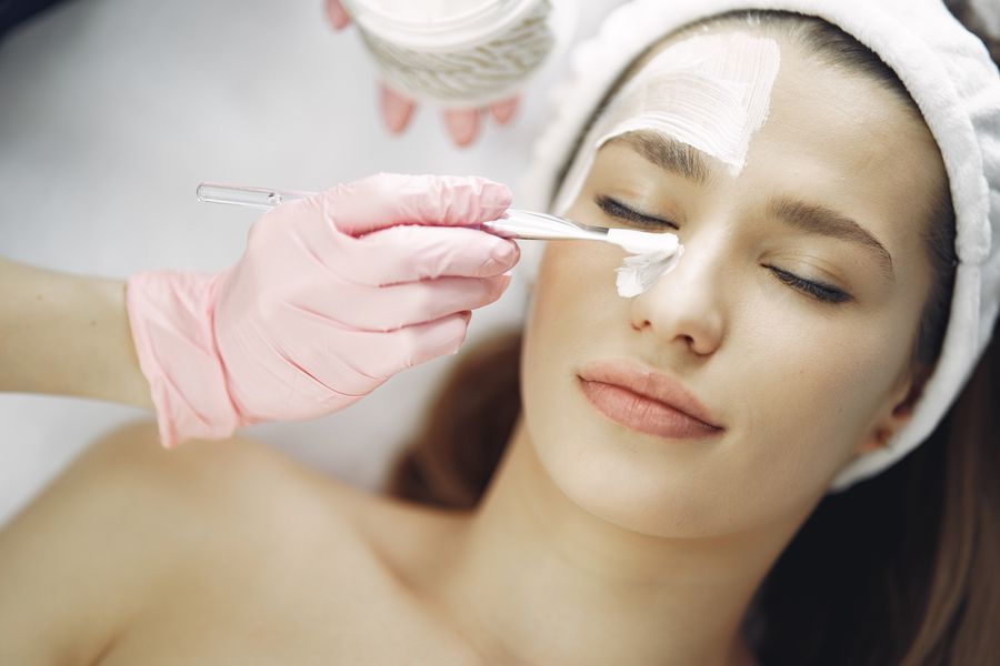 Woman receiving a facial treatment